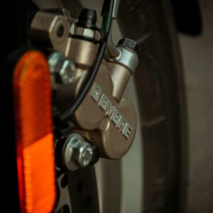 orange and silver bicycle wheel