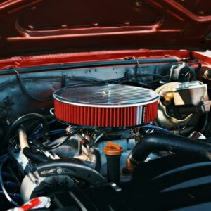 A classic car's engine bay is on display.