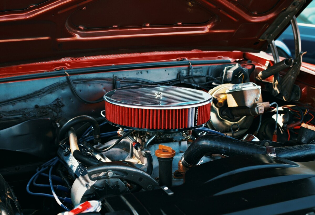 A classic car's engine bay is on display.