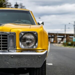 yellow car on road during daytime