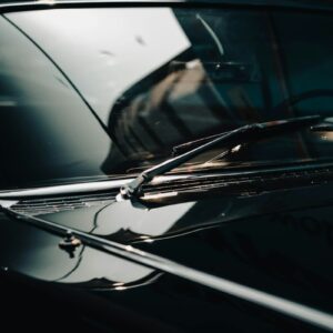 Close-up of a vintage car's windshield and hood
