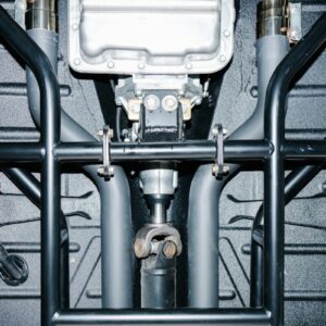 Underside view of a car's drivetrain and roll cage