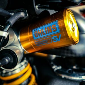 Close-up of an öhlins motorcycle shock absorber.