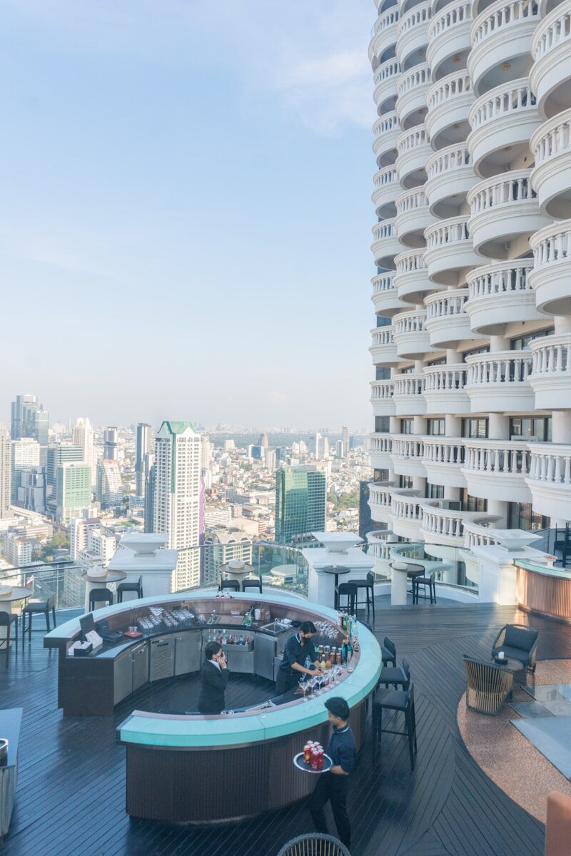 A very tall building with a bunch of tables in front of it