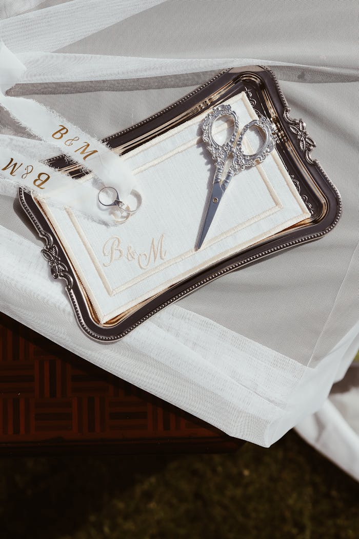 Elegant wedding invitation set with monogram B&M on a silver tray.